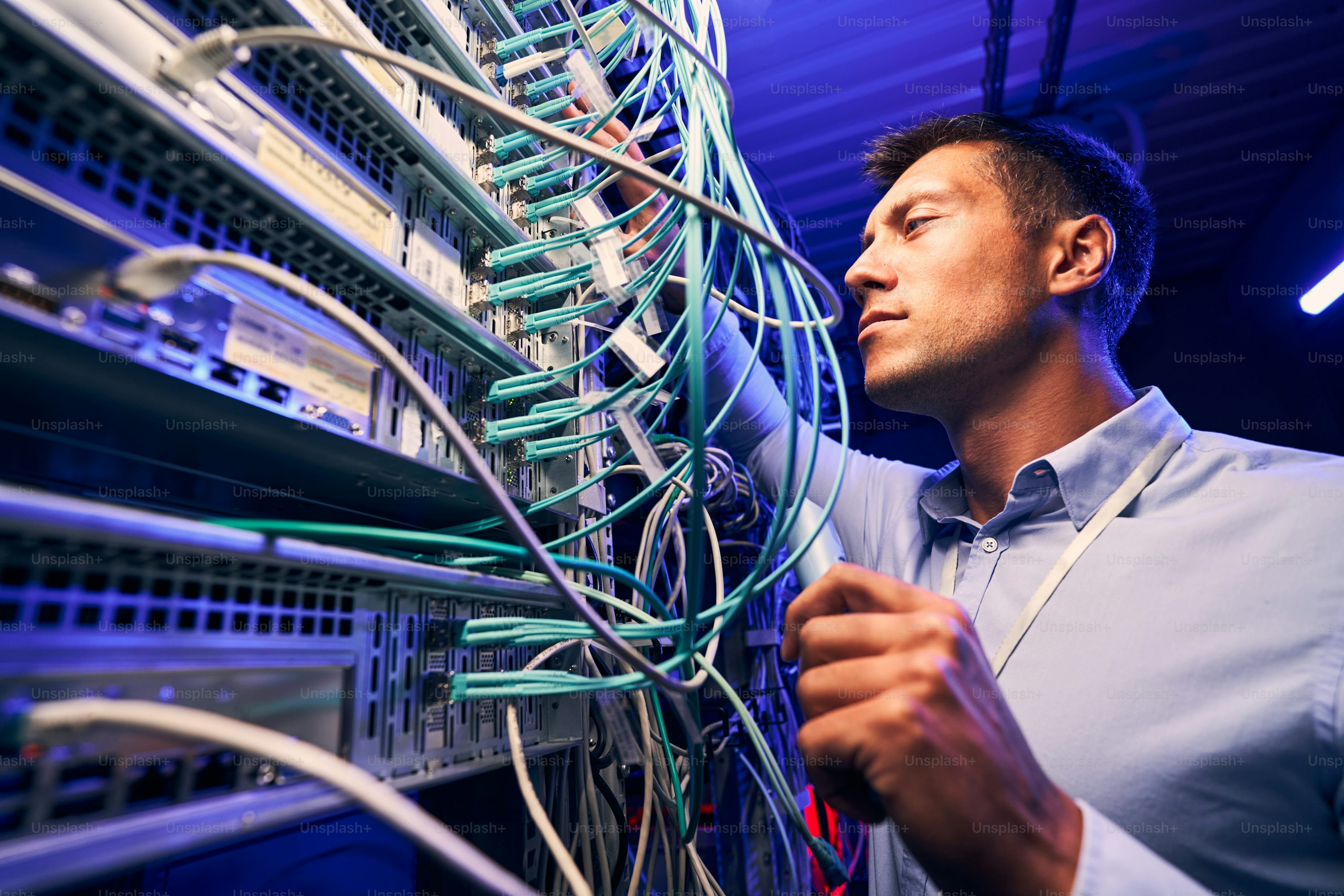IT technician working on server rack